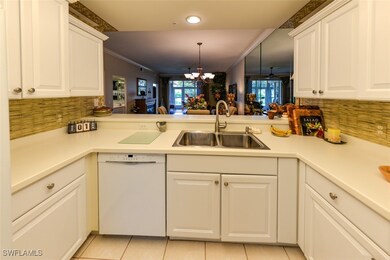 Kitchen featuring kitchen peninsula, dishwasher, l