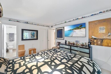 Bedroom with a closet and ensuite bathroom