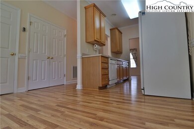 Kitchen from Dining area shows utility closet