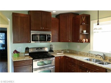 Cherry cabinets, Stainless and glass double oven GAS with 5 burners. Granite, pull out faucet sprayer, garbage disposal, pull out pantry, stained glass light fixtures. (kitchen redone in 2010)
