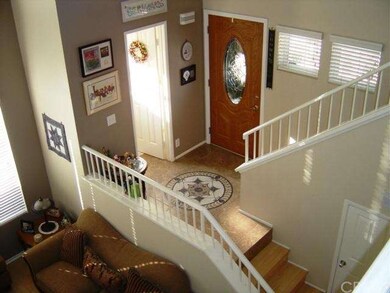 Entry is mid-level between first and second floors