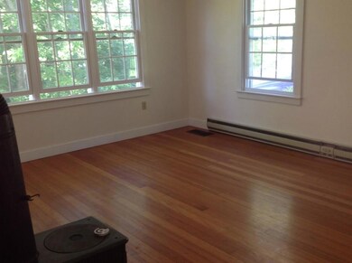 Living room with woodstove hook up...