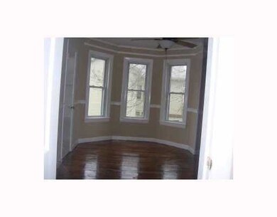 Living Room. Gleaming wood floors and replacement