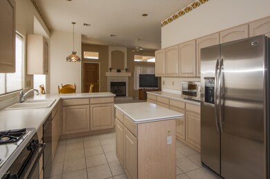 Kitchen with gas range, microwave and