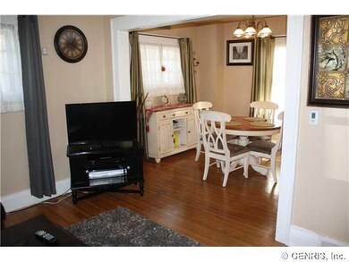 View. LOOKING FROM THE LIVING ROOM INTO THE DINING