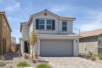 Mediterranean / spanish home with driveway, a tile