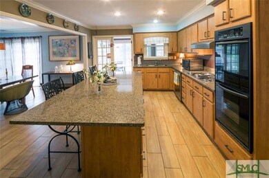 Kitchen with door to the summer room and fenced in