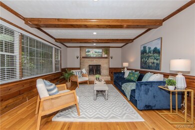 Living room featuring a fireplace, light hardwood