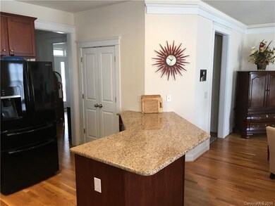 Large granite peninsula for food preparation and/o