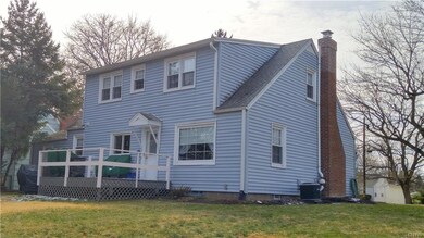 Back dormer allows for tall ceilings and a full ba