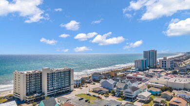 Birds eye view of property featuring a water view,