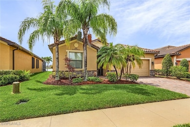 Mediterranean / spanish-style home featuring a gar