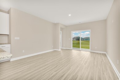 Unfurnished room with baseboards, light wood-type 