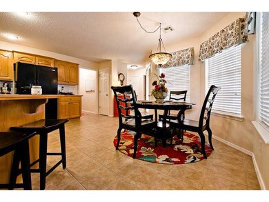Kitchen. Family time can be spent in extra eating areas with easy access to kitchen and patio.