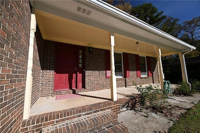 View of exterior entry featuring a porch
