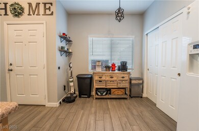 Foyer entrance with light wood-style flooring and