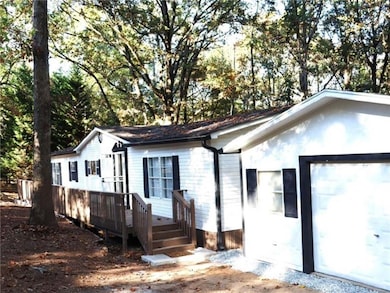View of property exterior featuring a deck