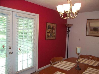 Large dining room with French doors leading to bac