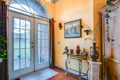 Entry with french doors and bamboo floor.