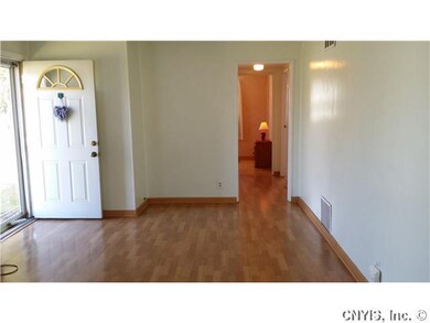 Living Room. Front door.  Wood laminate floored th