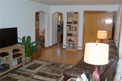 LIVING ROOM SHOWING FRONT DOOR ENTRY, GUEST CLOSET