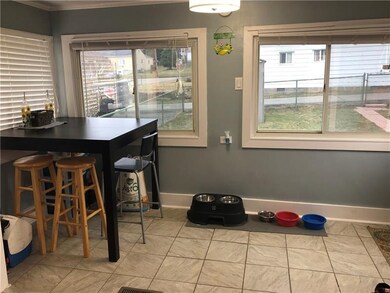 Eat-in area of kitchen with new tile flooring and 