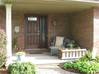Newer front door with screened side light that ope