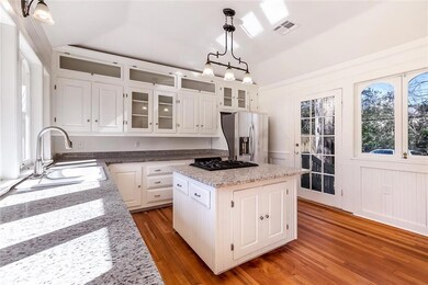 A center island with cooktop anchors the light-fil