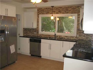 Kitchen in main house, features, new cabinets, granite countertops, designer back splash, and stainless steel appliances.