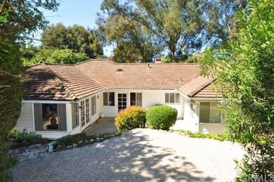 Back of home features park like grounds