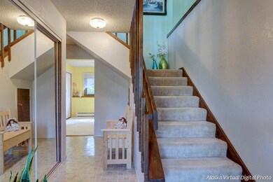 Entryway with stairs to upper level