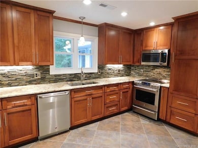 Enjoy this updated kitchen with beautiful cabinetr