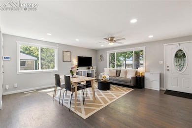 Living room featuring recessed lighting, healthy amount of natural light, wood finished floors, and a ceiling fan