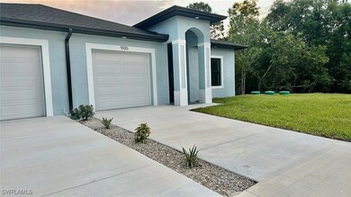 View of front of property with a garage and a fron