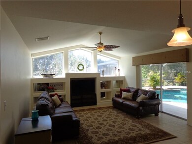Family room with sliders and view to pool area