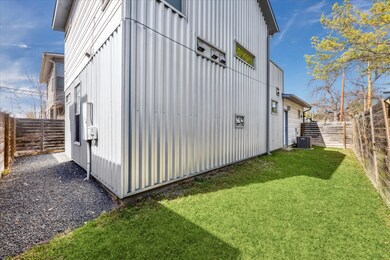 View of side of home featuring central air condit