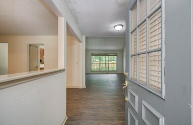 Front door opens to the living room which overlook