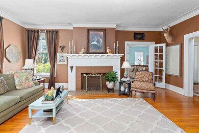 Living room with detailed trim work at the firepla