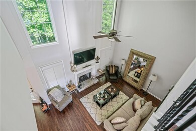 Living room with baseboards, a fireplace with rais