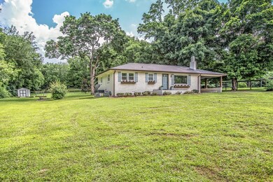 THIS LOVELY HOME SITS ON 1- ACRE WITH MATURE AND MAJESTIC TREE'S ON ALL SIDES