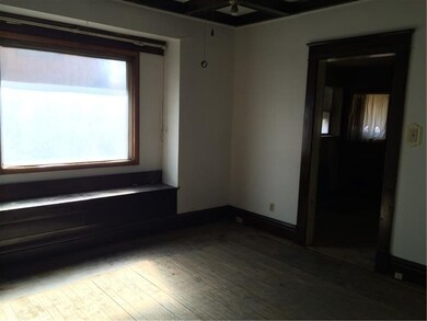 Dining Room with dark wood accents and window seat