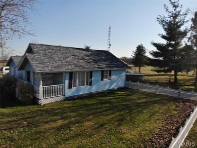 View of front of house featuring roof with shingles