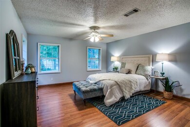 Roomy master bedroom. Windows bring in light.