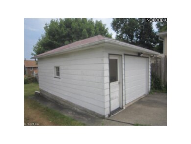14'x 21' garage with new 9'x 7' overhead door.