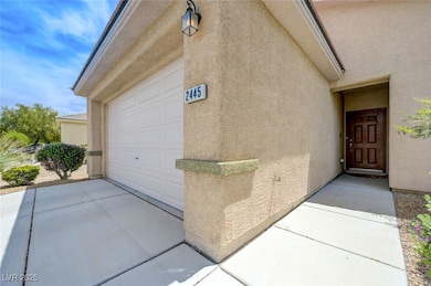 View of exterior entry with stucco siding and conc