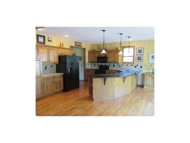 Kitchen has Granite Counters & Tile Backsplash