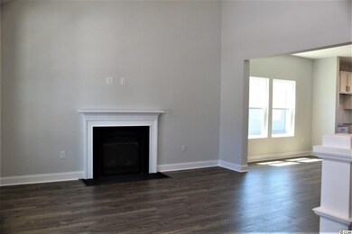 Open fireplace with vaulted ceiling, dining room a