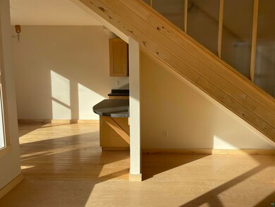 Stairs with hardwood / wood-style flooring