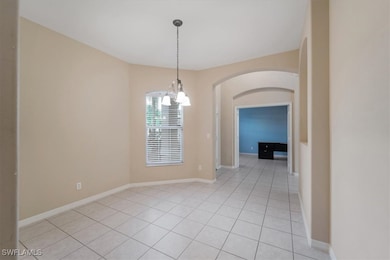 Unfurnished dining area featuring light tile patte