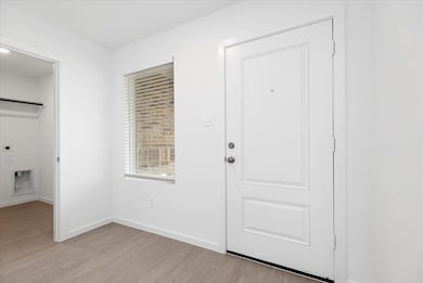 Laundry room located off the garage
